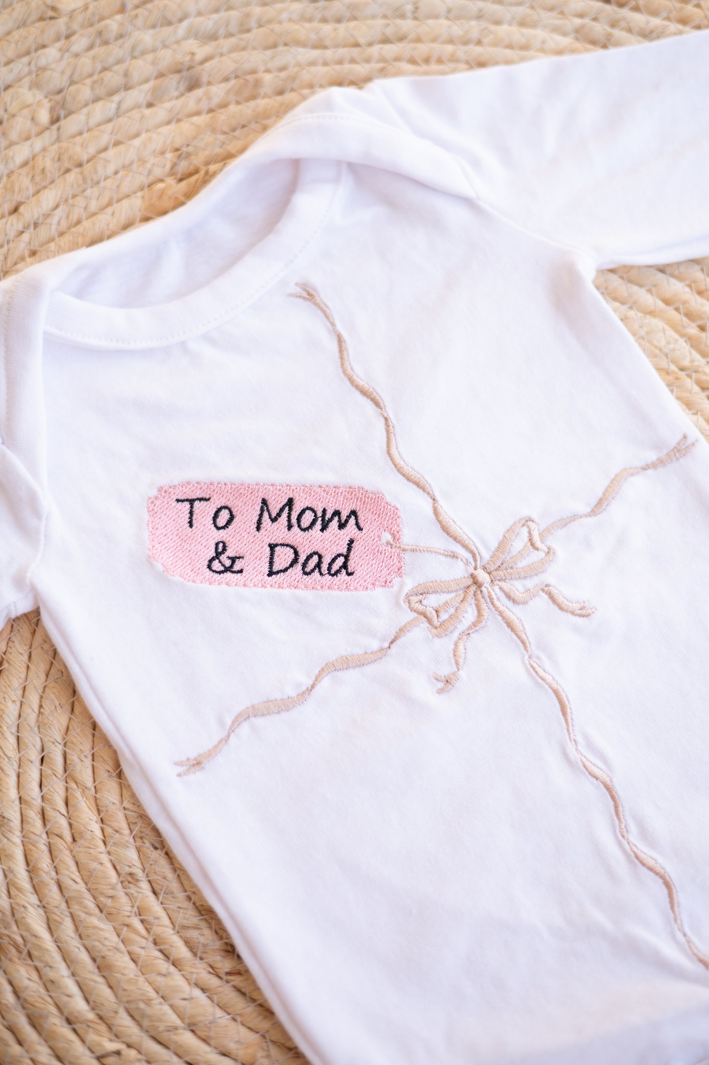 Embroidered "gift" onesie