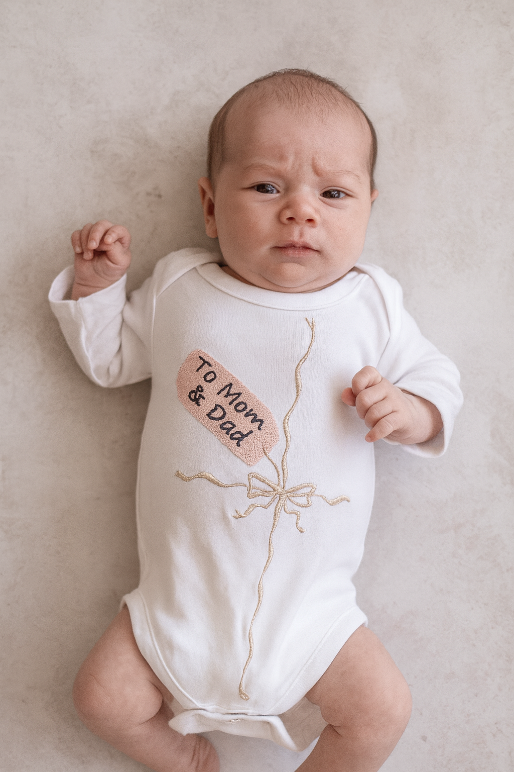 Embroidered "gift" onesie