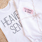Embroidered "gift" onesie