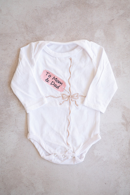 Embroidered "gift" onesie